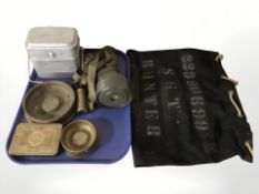 A gas mask, military canteen, trench art ashtrays, monocular and a reproduction 1914 Christmas tin.