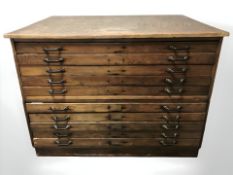 A late Victorian oak and pine ten drawer plan chest,