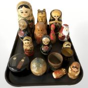 A group of Russian lacquered babushka dolls, pots, etc.
