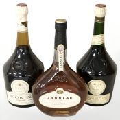 Two bottles of Benedictine liqueur and a bottle of Janneau Grand Armagnac