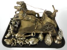 A brass charioteer figure group, brass hand bells and other ornaments.