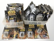A collection of Star Wars Official Figurine Collection magazines and figures,