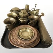An inert brass shell casing, several pestles and mortars, an oil can, copper dishes, etc.