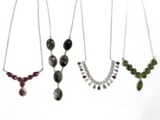 Four sterling silver necklaces set with semi precious stones