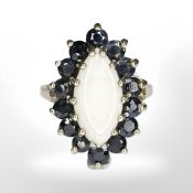 A 9ct yellow gold synthetic opal and sapphire ring, size J/K CONDITION REPORT: 4.5g.