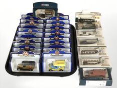 A collection of Oxford, Lledo and Corgi die cast vans, trams, etc.