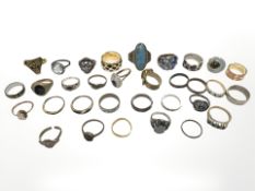 Thirty two dress rings, some set with semi precious stones etc.