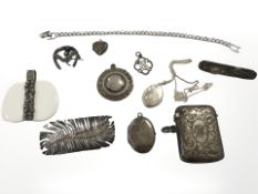 A group of silver and white metal jewellery items to include vesta case, sporting fob, brooches,