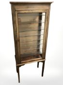 An early 20th century mahogany display cabinet with internal glass shelves,