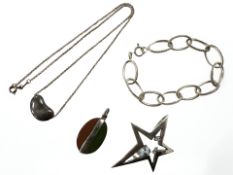 A Sterling silver Tiffany necklace with pebble pendant together with silver star shaped pendant,