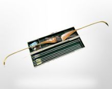 An archery bow and box containing quiver,