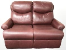 A modern burgandy leather two seater settee,