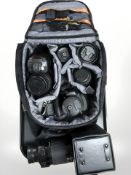 A Fujifilm Finepix HS20 digital camera, in bag with several lenses,