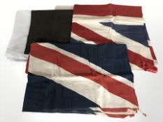 Two vintage union flags and a further modern flag.