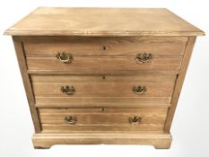 An Edwardian pine three-drawer chest,