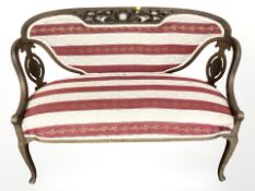 A late Victorian mahogany framed two seater settee,