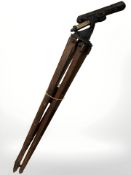 A large telescope tripod with cast iron fitting,