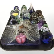 A group of glass paperweights including a starfish example, several Caithness paperweights,