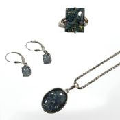 A sterling silver necklace with synthetic opal pendant together with matching dress ring and pair
