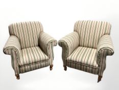 A pair of contemporary Victorian style armchairs in striped fabric,
