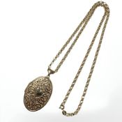 A 9ct yellow gold oval locket on 9ct gold chain CONDITION REPORT: 10g.