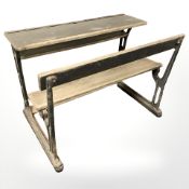 An early 20th century oak double school desk,