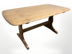 An Ercol stained elm refectory dining table, 150 cm x 84 cm x 72 cm,