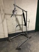 A hydraulic hoist on trolley castors