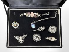 A group of silver and white metal jewellery items including Art Nouveau style brooch,