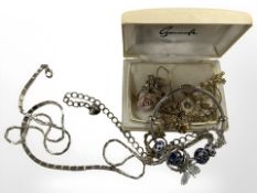 A group of costume jewellery items, gold plated chains, charm bracelet,