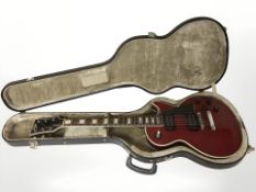 A Hondo II electric guitar with hard carry case