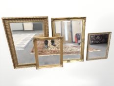 A group of four gilt framed bevelled mirrors, largest 87 cm x 60 cm.