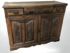 An Art Nouveau walnut sideboard,