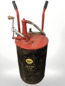 A Shell spirax barrel on sack barrow with hose