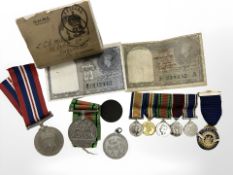 Two WW II medals together with miniature medal group and a silver and enamel Rotary club medal on