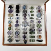 A group of fifty sterling silver and white metal dress rings, cased.