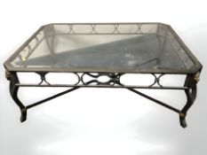 A contemporary metal and bevelled glass coffee table,