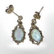 A pair of 9ct yellow gold opal earrings