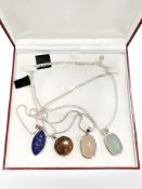 Four Sterling silver necklaces with polished stone pendants
