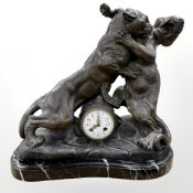 A French patinated spelter and marble mantel clock, after Thomas Cartier,