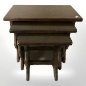 A Jaycee oak nest of three tables,
