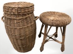 A wicker barrel shaped hamper and a small table.