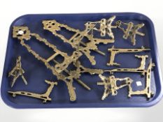 A group of miniature brass easels.