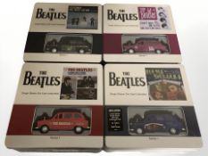 Four Factory Entertainment The Beatles die cast collector's tins, each containing die cast vehicles,