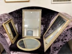 Four contemporary gilt framed mirrors, largest 64 cm x 90 cm.
