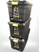 Three large plastic storage boxes,