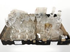 A group of crystal decanters and drinking glasses.