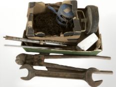 A group of hand tools including large wrench, pair of bolt cutters, lengths of chain, etc.