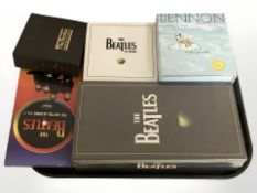 Five The Beatles and John Lennon CD box sets.