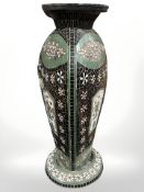 A decorative mosaic pottery triangular section vase, height 75 cm.